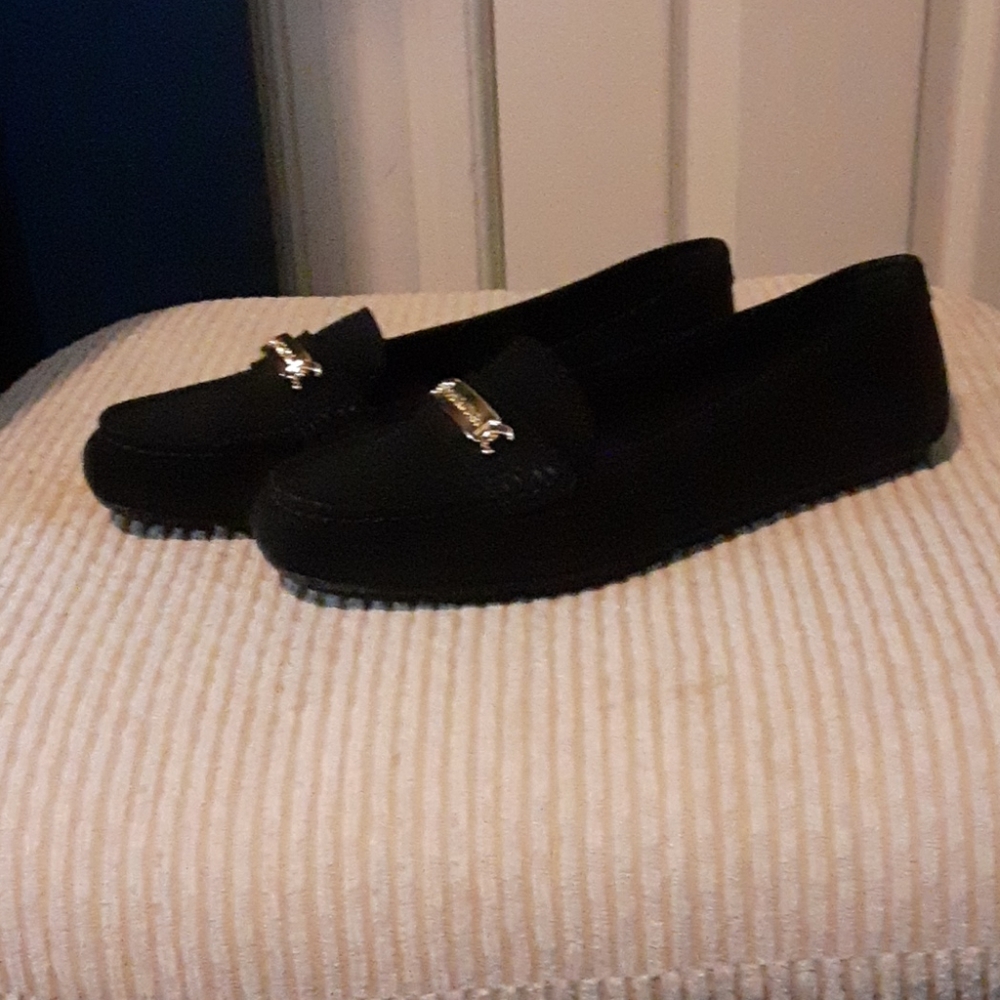 Black Calvin Klein Flats. Never worn
